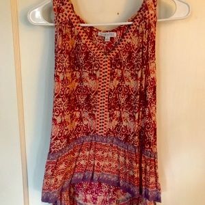 Adorable short/long sleeveless flirty top